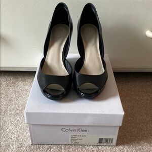 New with box. Calvin Klein Gabbie Peep Toe Wedge (7.5)
